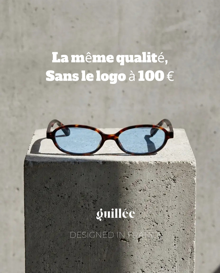 Lunettes de soleil bleu clair AEB GUILLEE sur socle béton